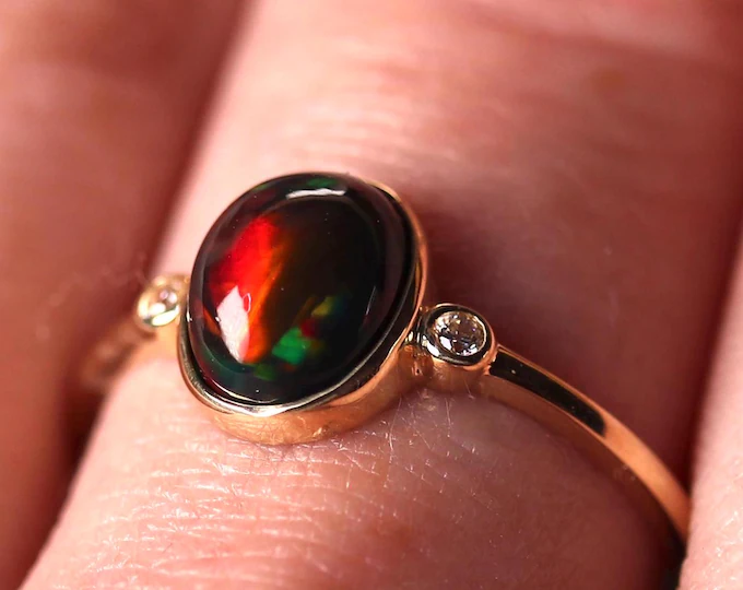 Celtic knot silver engagement ring featuring a genuine black fire opal stone with red play of color - natural opal ring tarnish resistant